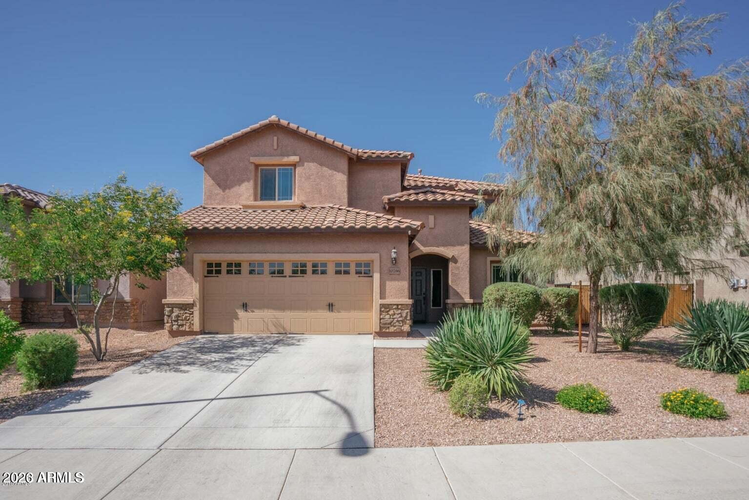 10786 West Yearling Road Peoria, AZ 85383 - Photo 1 of 21 a house with a garden and pathway