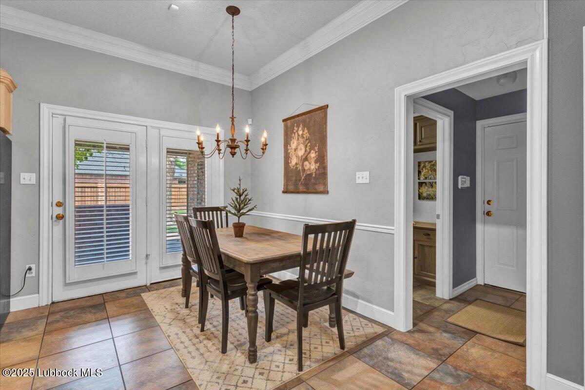 7206 76th Street Lubbock, TX 79407 - Photo 12 of 55 a dining room with furniture and window