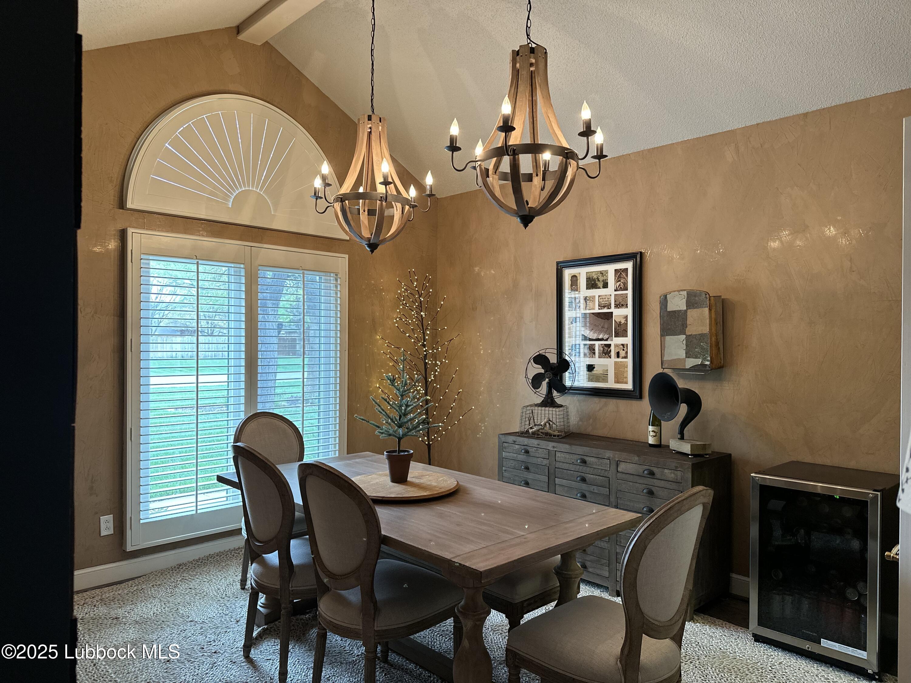 7206 76th Street Lubbock, TX 79407 - Photo 14 of 55 a view of a dining room with furniture window and wooden floor