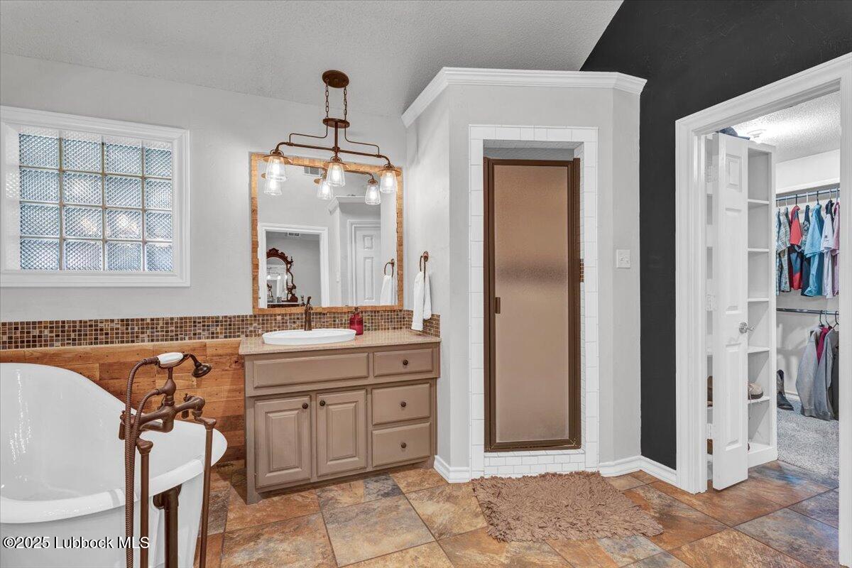 7206 76th Street Lubbock, TX 79407 - Photo 20 of 55 a bathroom with a sink and a mirror