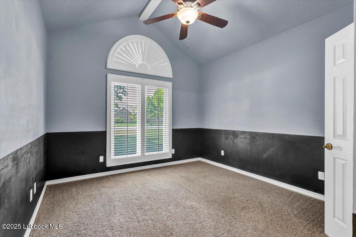 7206 76th Street Lubbock, TX 79407 - Photo 23 of 55 en empty room with windows and ceiling fan