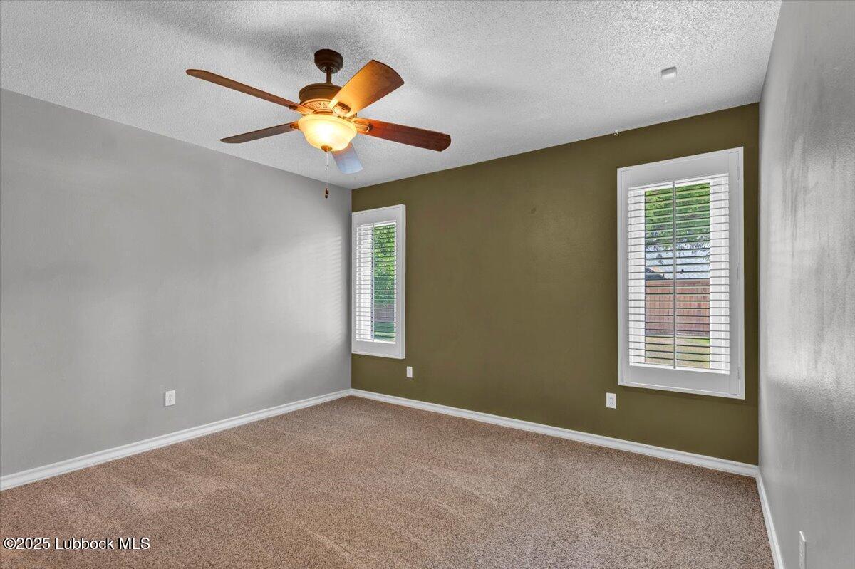 7206 76th Street Lubbock, TX 79407 - Photo 28 of 55 a view of an empty room with a window