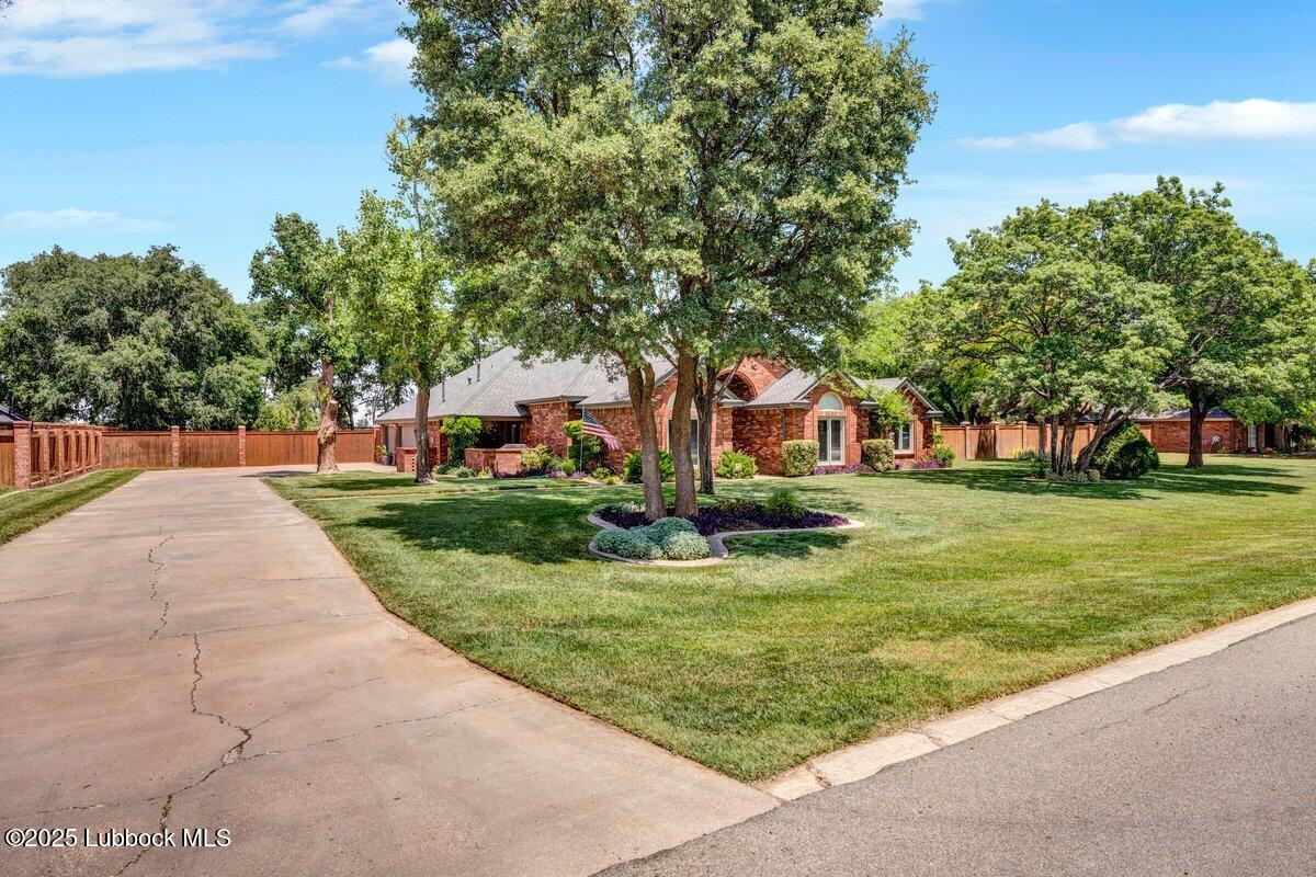 7206 76th Street Lubbock, TX 79407 - Photo 3 of 55 a view of a park with plants and trees