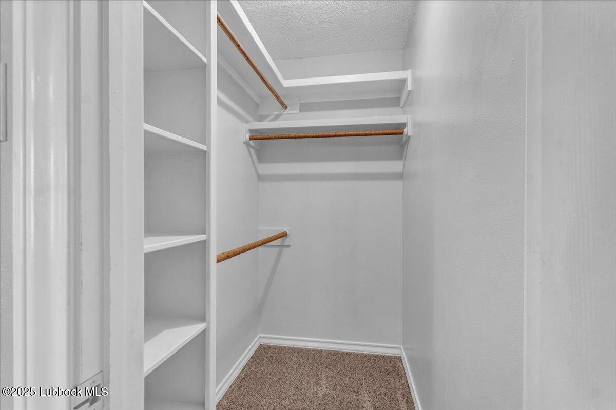 7206 76th Street Lubbock, TX 79407 - Photo 31 of 55 a view of walk in closet