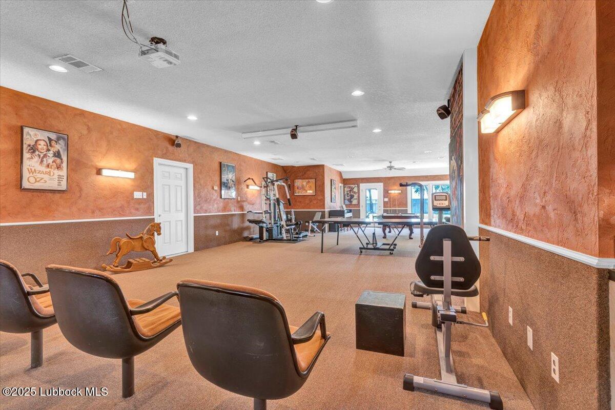 7206 76th Street Lubbock, TX 79407 - Photo 35 of 55 a dining room with furniture and a floor to ceiling window
