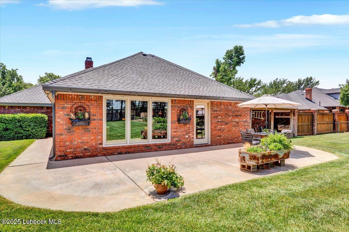 7206 76th Street Lubbock, TX 79407 - Photo 40 of 55 a front view of a house with garden