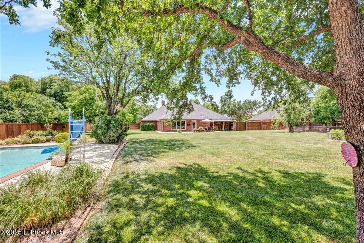 7206 76th Street Lubbock, TX 79407 - Photo 46 of 55 a view of a tree in a yard