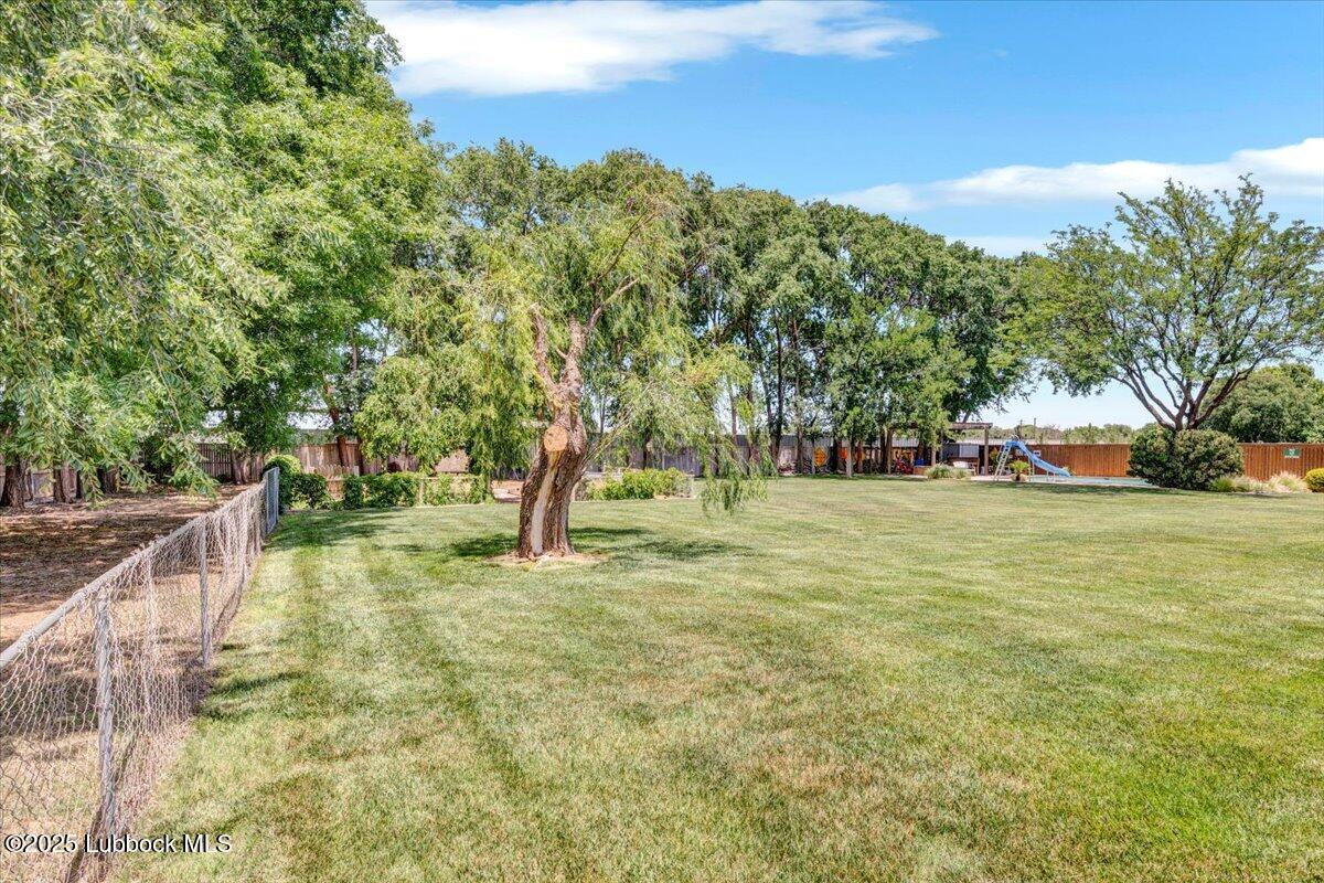 7206 76th Street Lubbock, TX 79407 - Photo 52 of 55 a view of a yard with a house