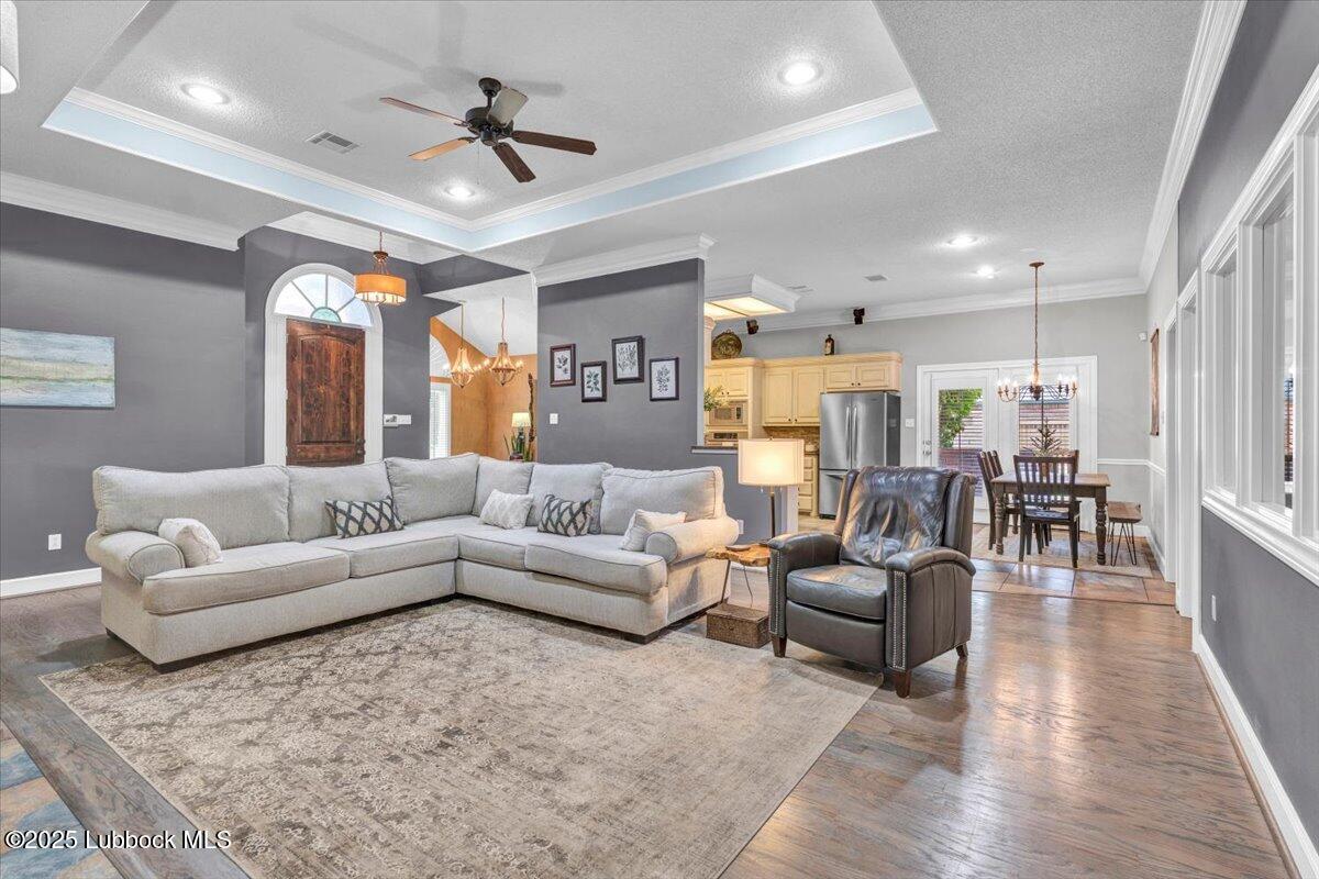 7206 76th Street Lubbock, TX 79407 - Photo 7 of 55 a living room with furniture and a large window