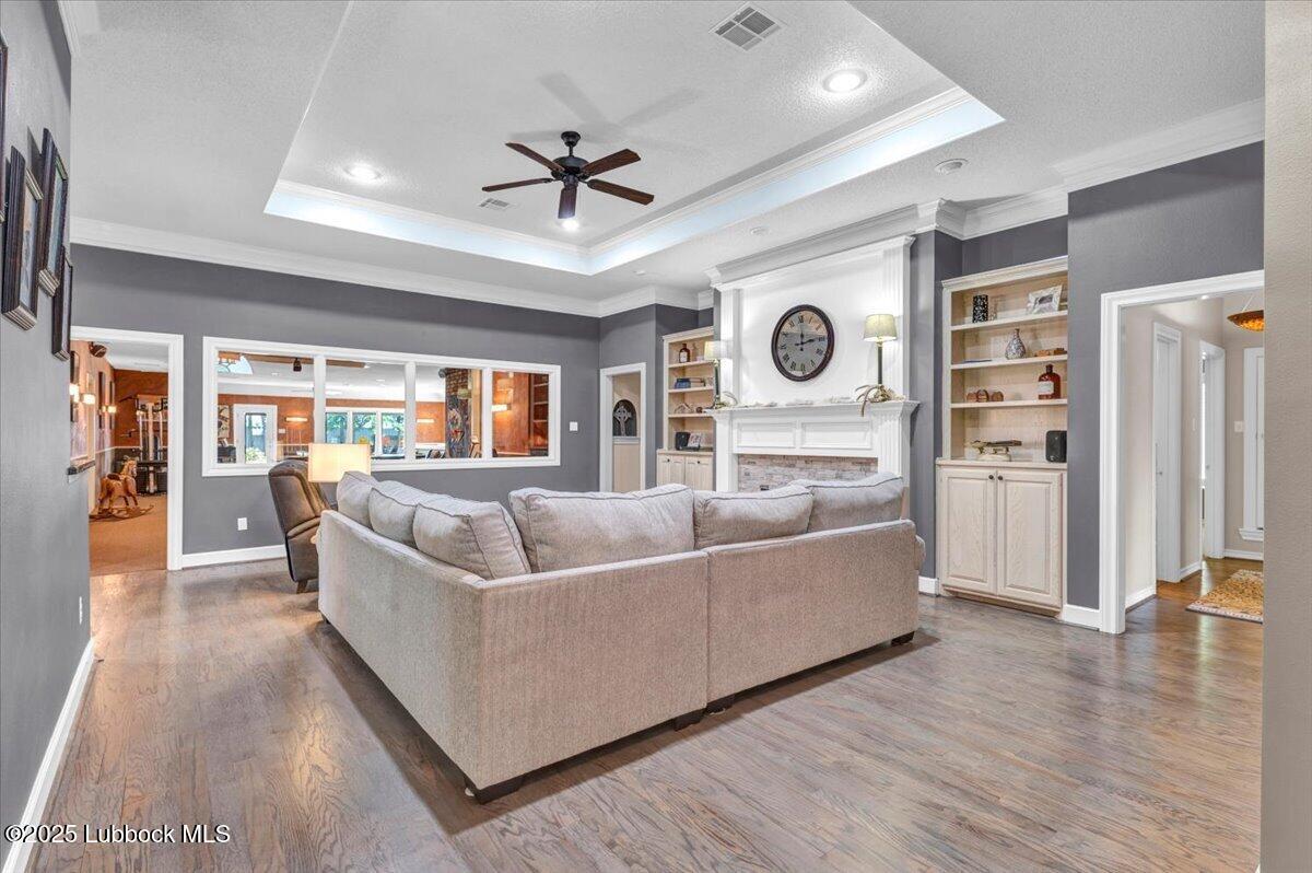 7206 76th Street Lubbock, TX 79407 - Photo 9 of 55 a living room with furniture and a large window