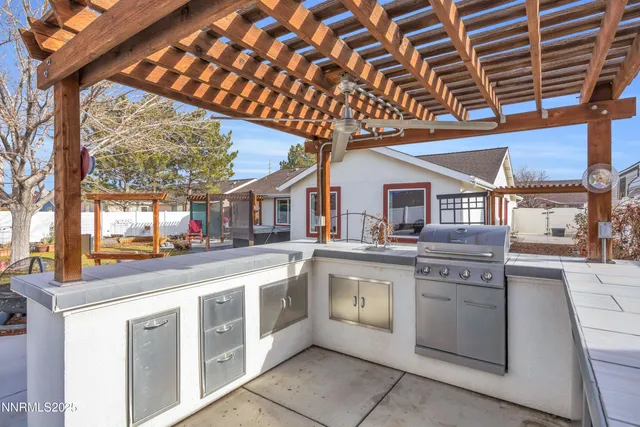 a open kitchen with stainless steel appliances granite countertop a stove and cabinets