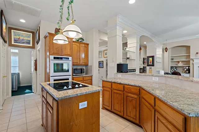 a kitchen with stainless steel appliances granite countertop a stove and a sink