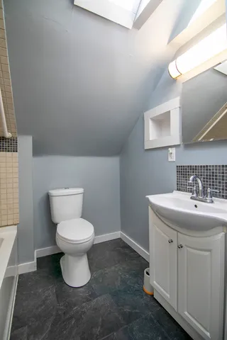 a bathroom with a sink and a toilet