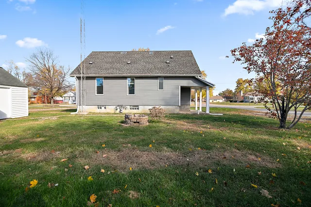 a front view of house with yard and trees