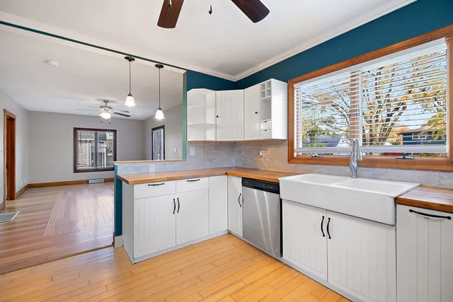 a kitchen with cabinets and window