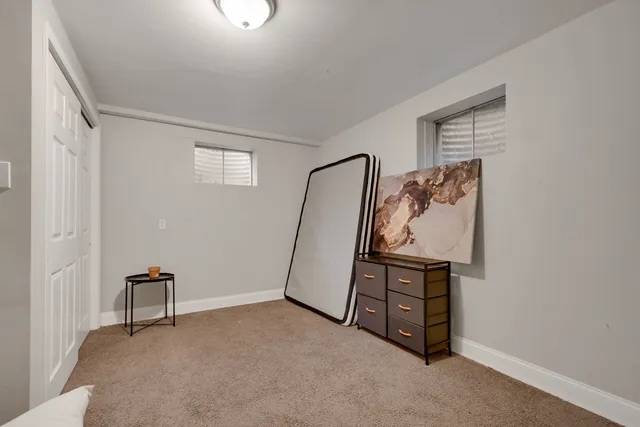 a bedroom with a bed and lamp