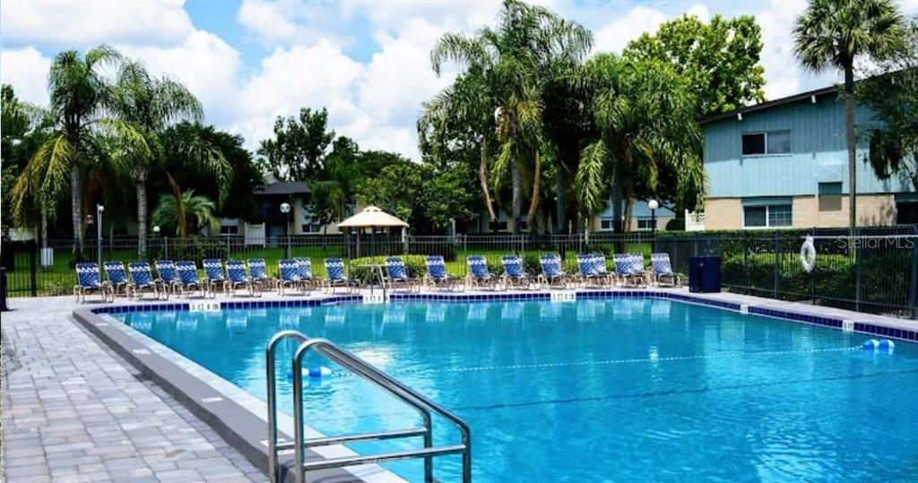1695 Lee Road, Unit B204 Winter Park, FL 32789 - Photo 2 of 2 a view of swimming pool with outdoor seating and plants
