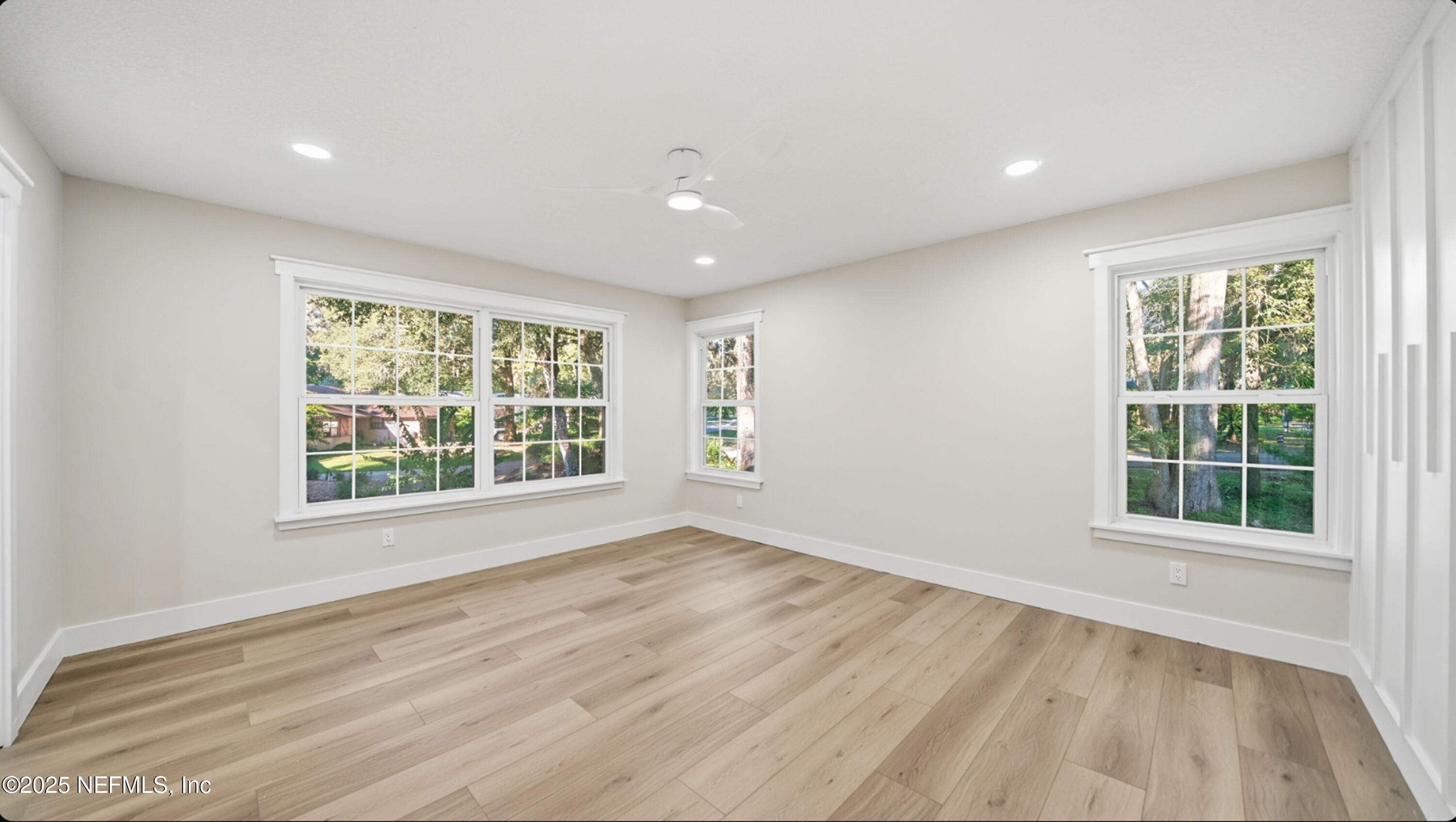 3217 Turtle Creek Road St. Augustine, FL 32086 - Photo 21 of 57 an empty room with wooden floor and windows