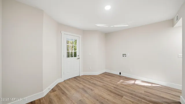 a bedroom with a bed and a chair