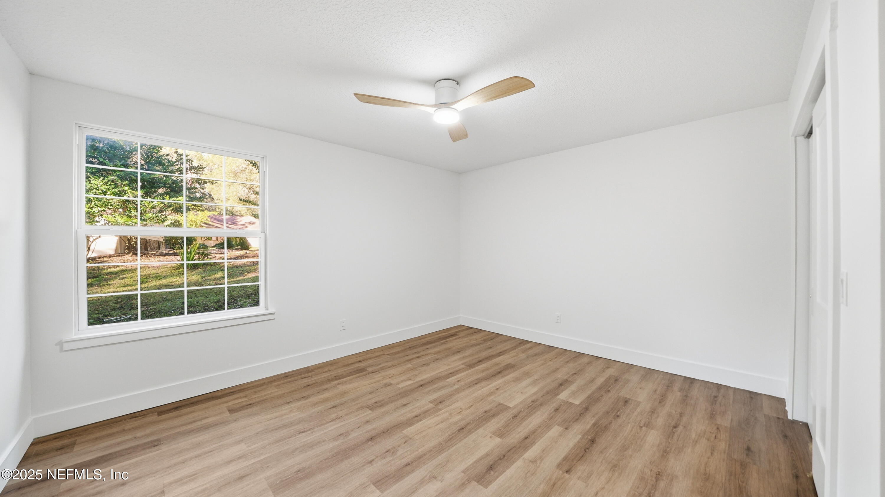 3217 Turtle Creek Road St. Augustine, FL 32086 - Photo 34 of 57 an empty room with wooden floor and windows