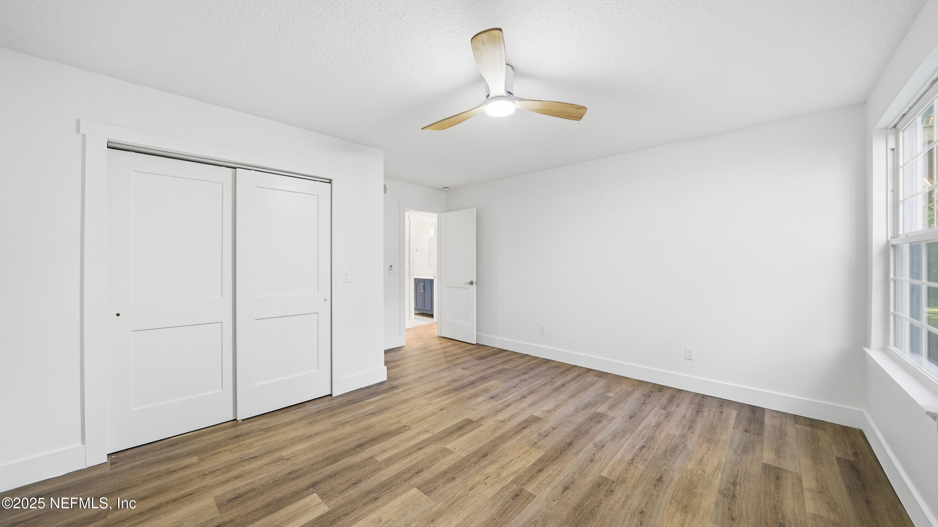 3217 Turtle Creek Road St. Augustine, FL 32086 - Photo 35 of 57 a view of an empty room with wooden floor and a window