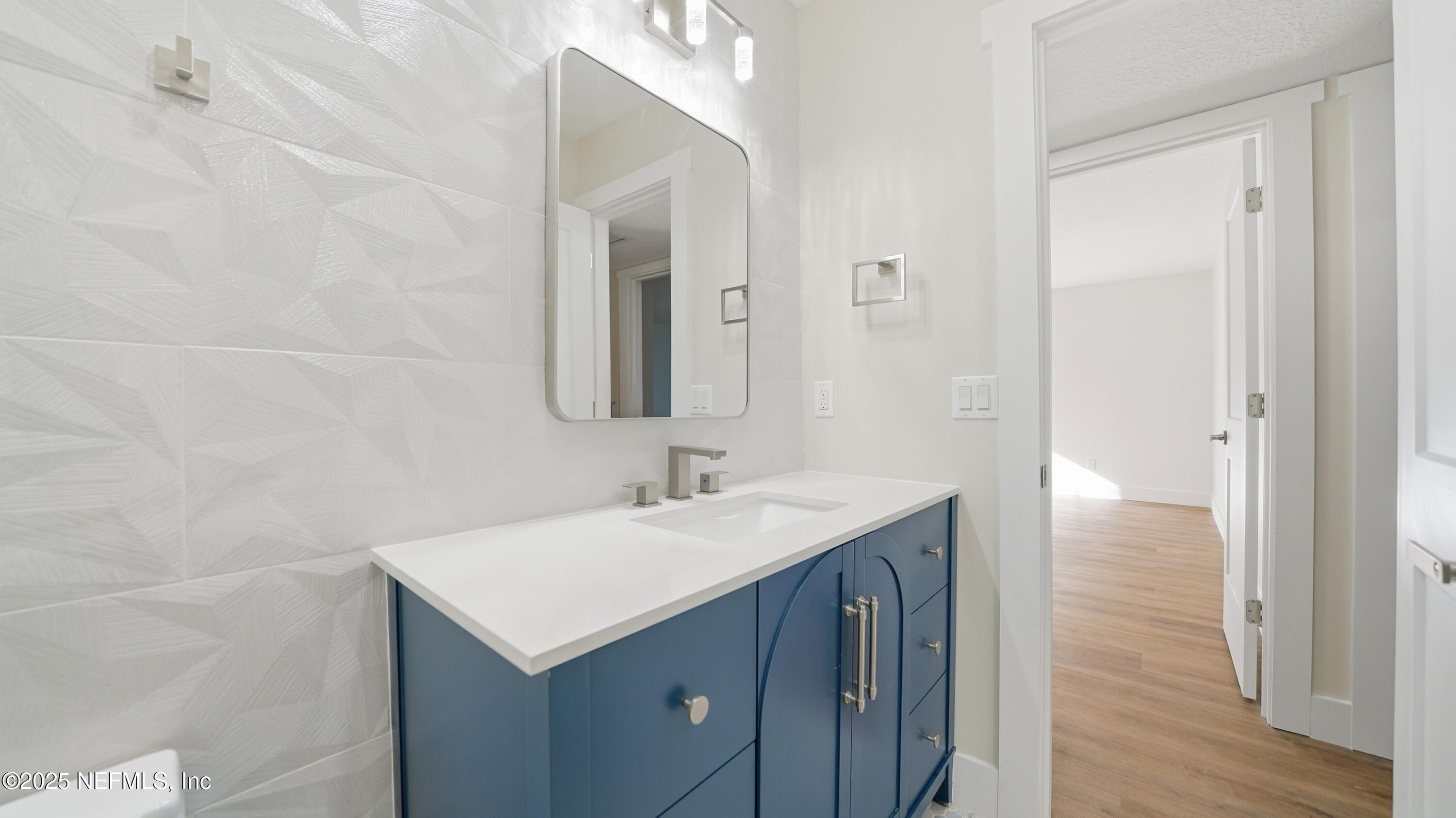 3217 Turtle Creek Road St. Augustine, FL 32086 - Photo 39 of 57 a bathroom with a sink and a mirror