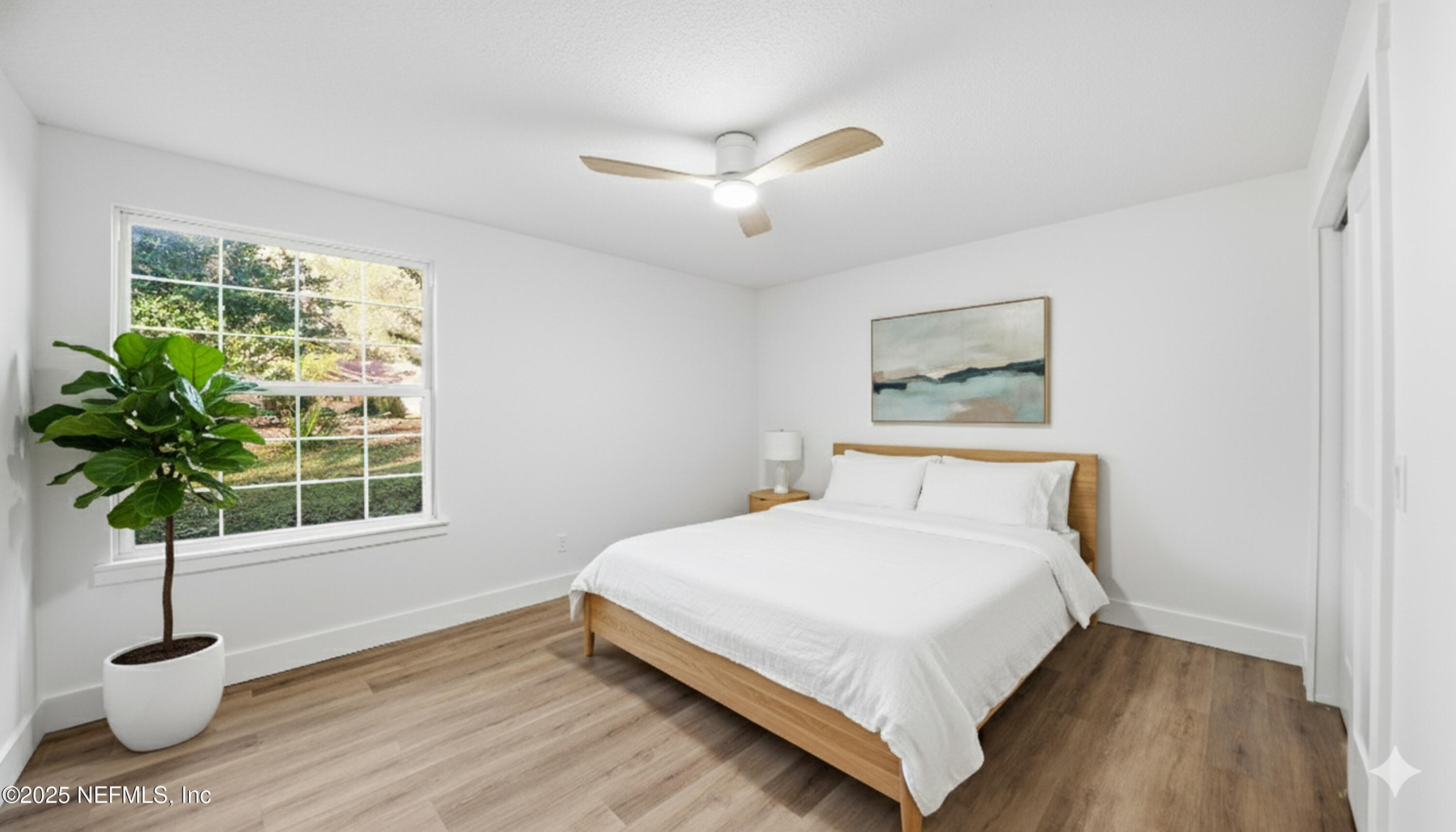 3217 Turtle Creek Road St. Augustine, FL 32086 - Photo 40 of 57 a bedroom with a bed and a potted plant