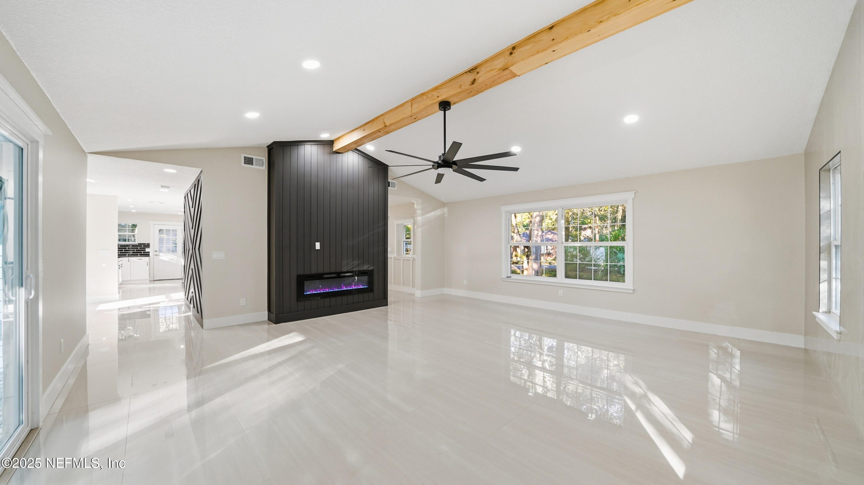 3217 Turtle Creek Road St. Augustine, FL 32086 - Photo 4 of 57 a view of a hallway with a window and a livingroom