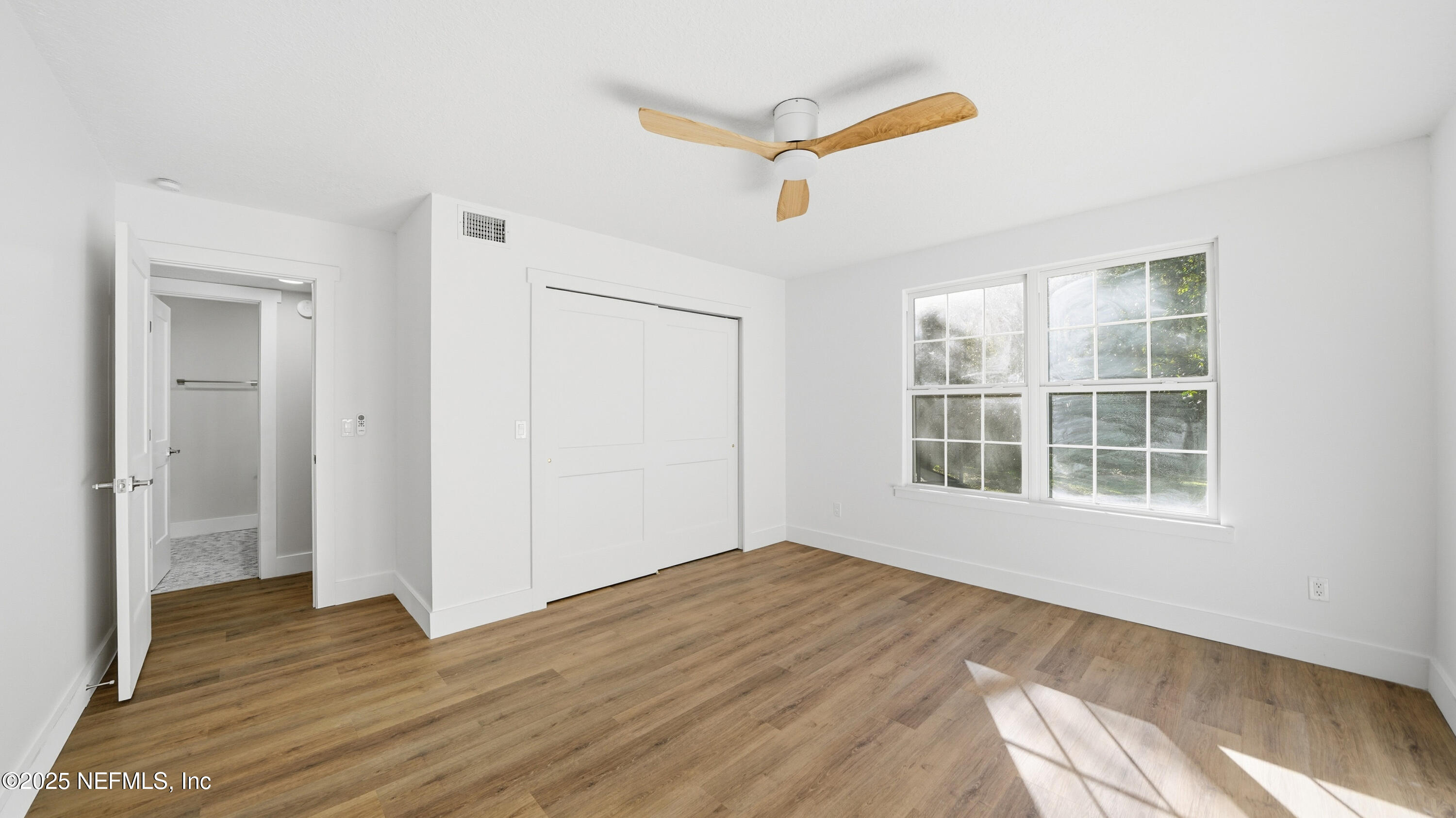 3217 Turtle Creek Road St. Augustine, FL 32086 - Photo 42 of 57 a view of empty room with wooden floor and fan