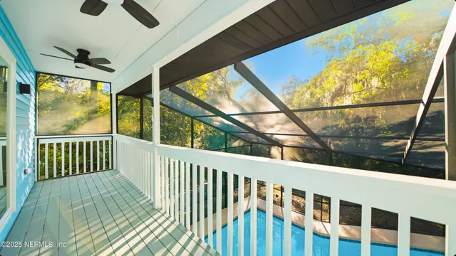 a view of balcony with wooden floor