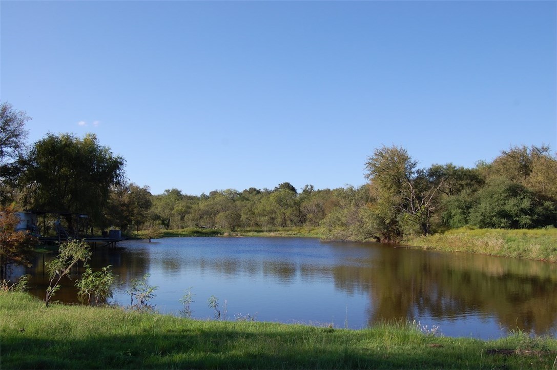 a view of lake with green space