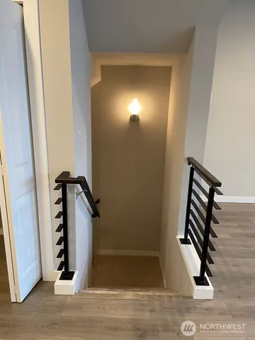 a view of an entryway with wooden floor