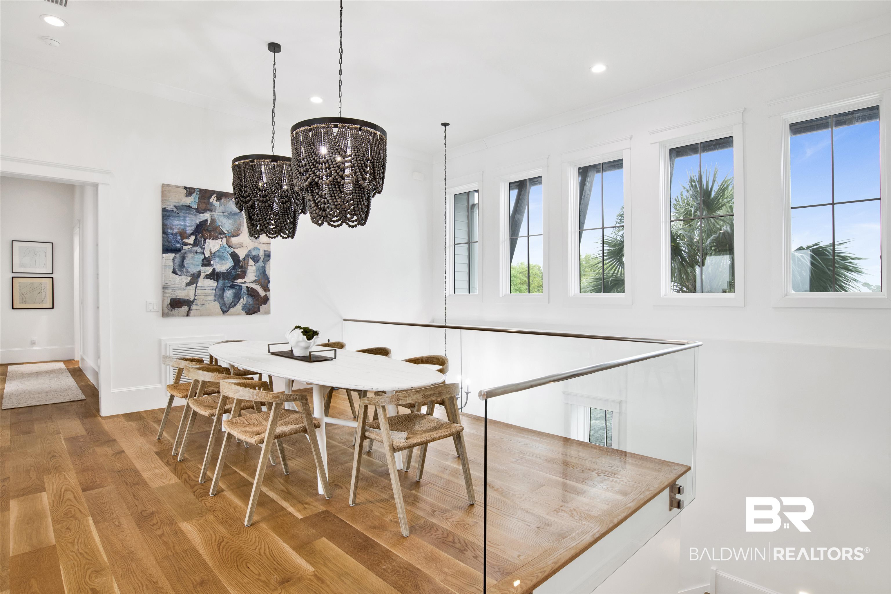 31320 River Road Orange Beach, AL 36561 - Photo 6 of 92 Dining room featuring recessed lighting, an inviting chandelier, ornamental molding, baseboards, and wood finished floors