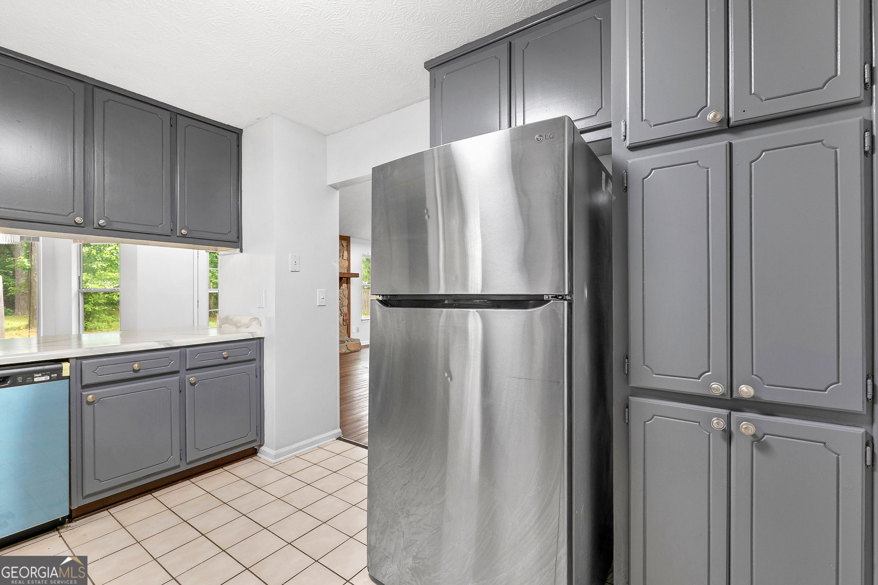 1328 Foxvale Drive Hampton, GA 30228 - Photo 5 of 27 a kitchen with stainless steel appliances granite countertop a refrigerator and a sink