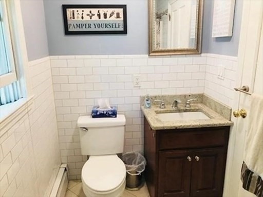 116 Upton Road Waltham, MA 02452 - Photo 13 of 15 a bathroom with a sink and a toilet