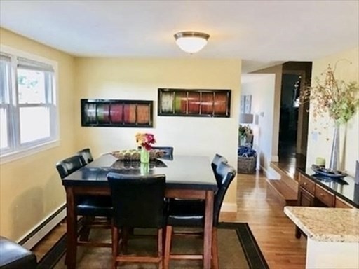 116 Upton Road Waltham, MA 02452 - Photo 8 of 15 a view of a dining room with furniture and wooden floor