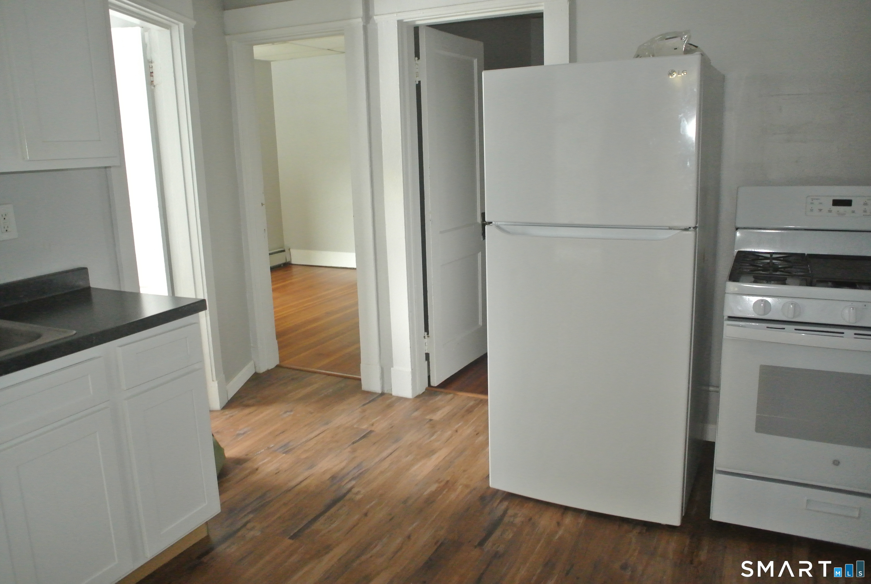 549 Howe Avenue, Unit A21 Shelton, CT 06484 - Photo 1 of 1 a view of a kitchen with a refrigerator and a stove