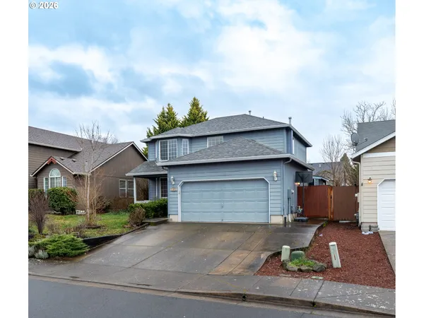 a front view of a house with garage