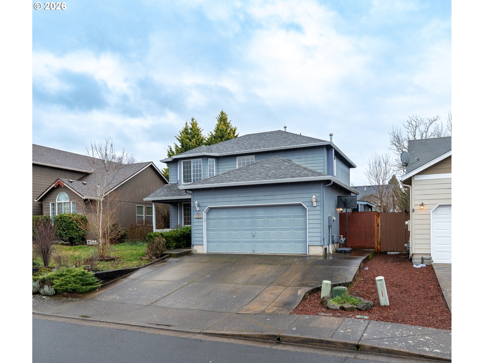 a front view of a house with garage