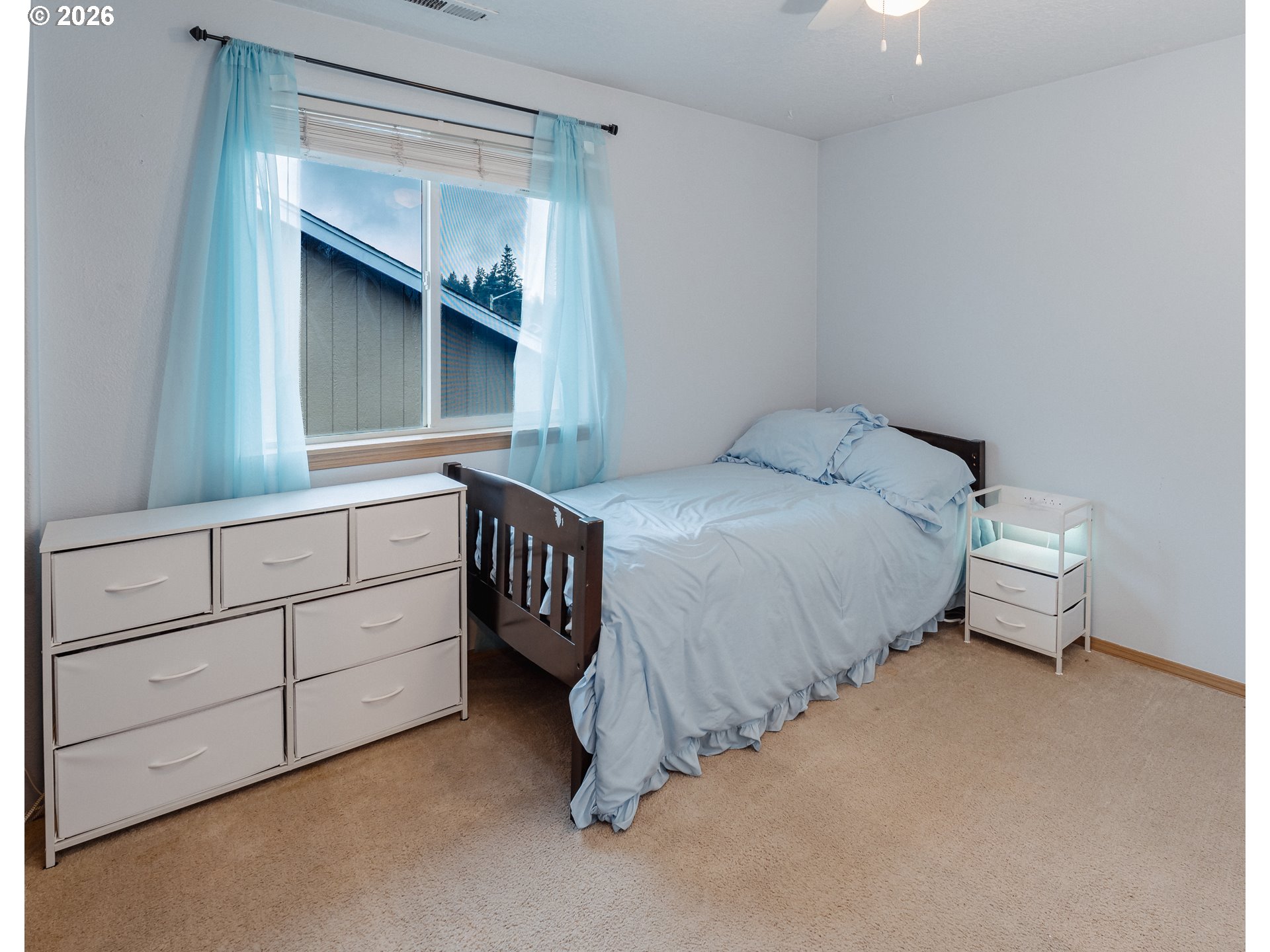 1254 Crystal Lane Lafayette, OR 97127 - Photo 18 of 34 a bedroom with a bed and a dresser