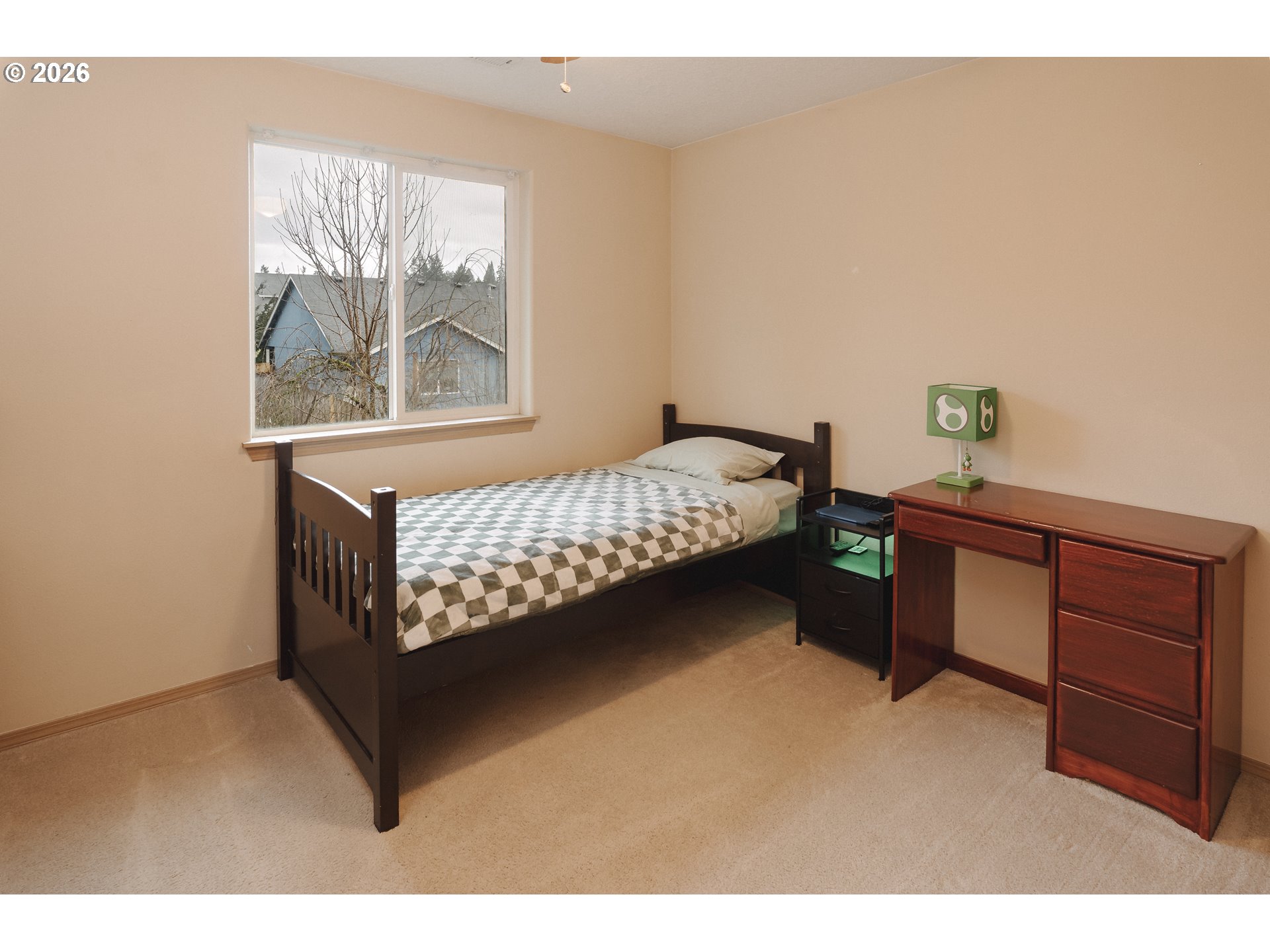 1254 Crystal Lane Lafayette, OR 97127 - Photo 20 of 34 a bed sitting in a bedroom next to a window