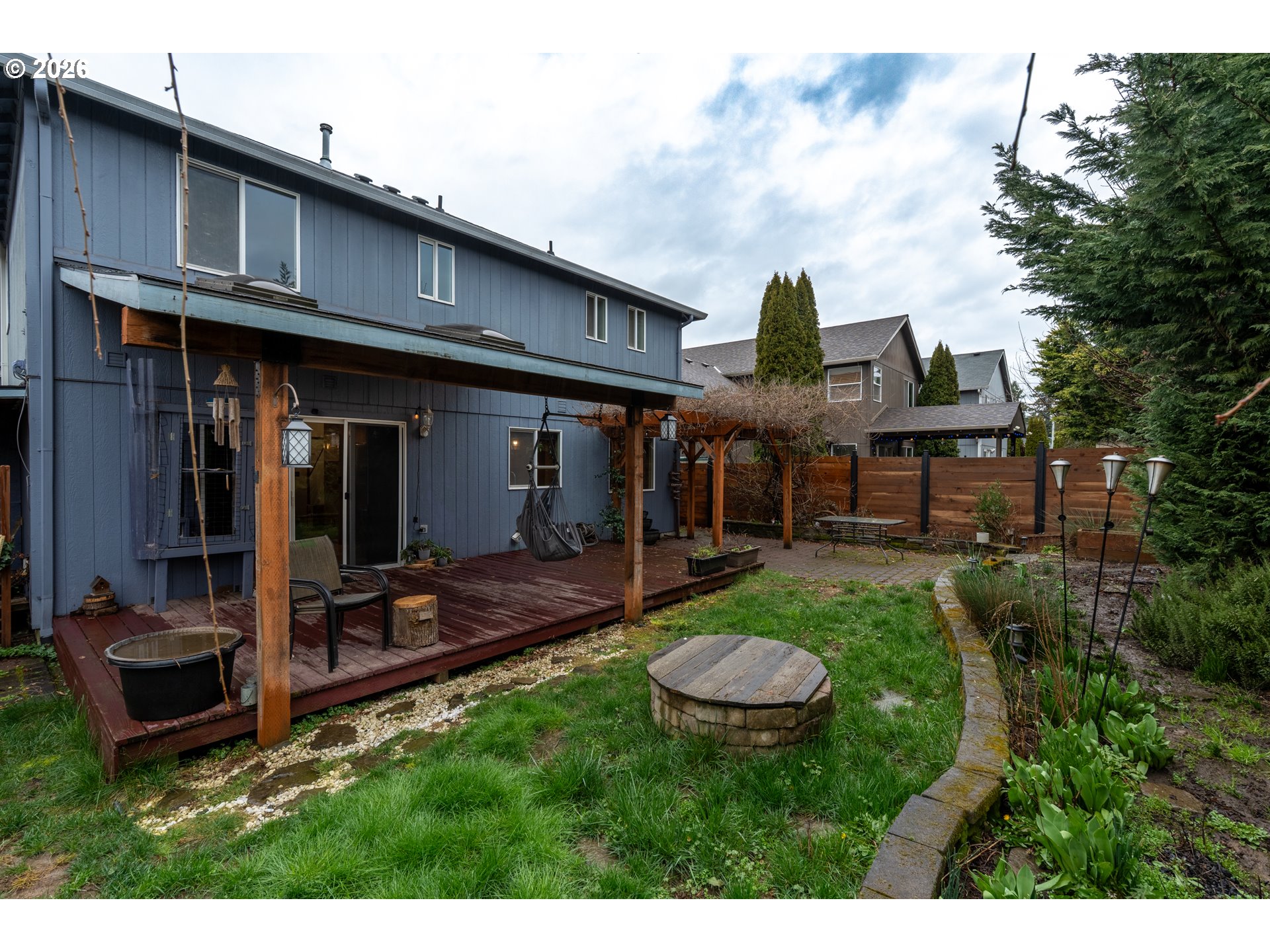 1254 Crystal Lane Lafayette, OR 97127 - Photo 26 of 34 a view of a house with backyard sitting area and garden