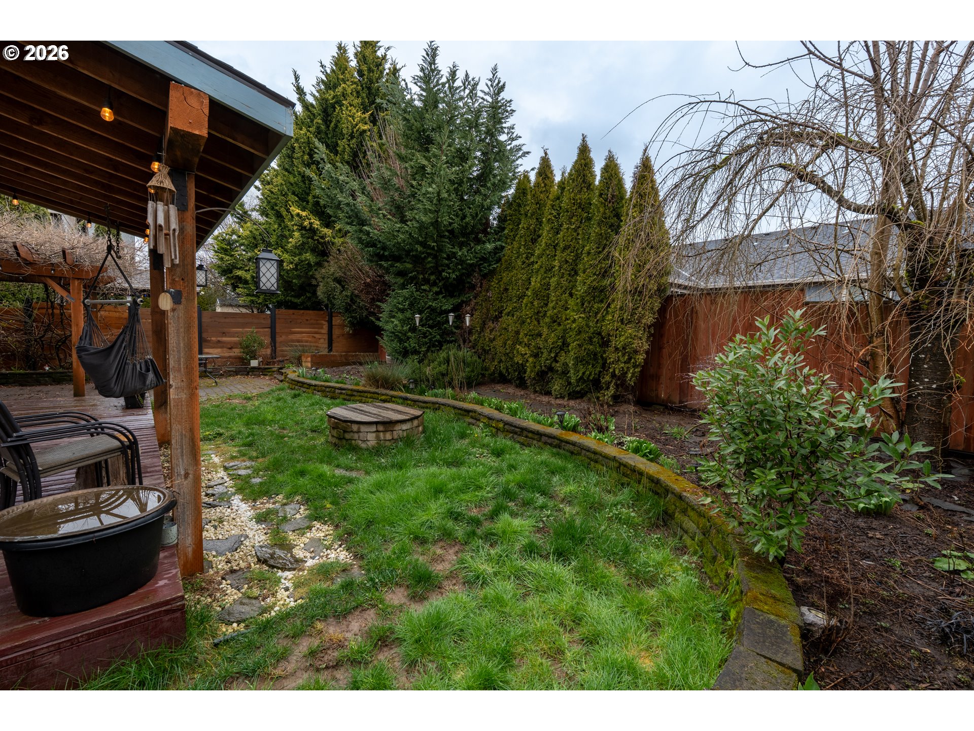 1254 Crystal Lane Lafayette, OR 97127 - Photo 27 of 34 a view of a backyard with plants and a patio