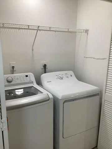 a view of a house with a swimming pool and a garden