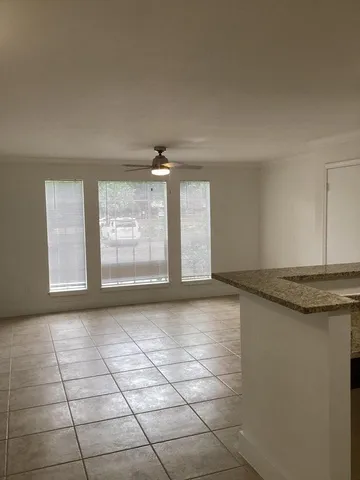 a view of a kitchen counter top space and cabinets