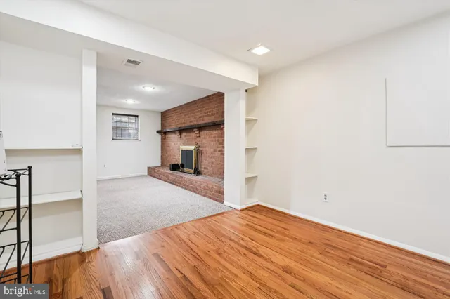 a bedroom with a bed and a view of kitchen
