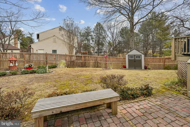 a view of house with wooden fence