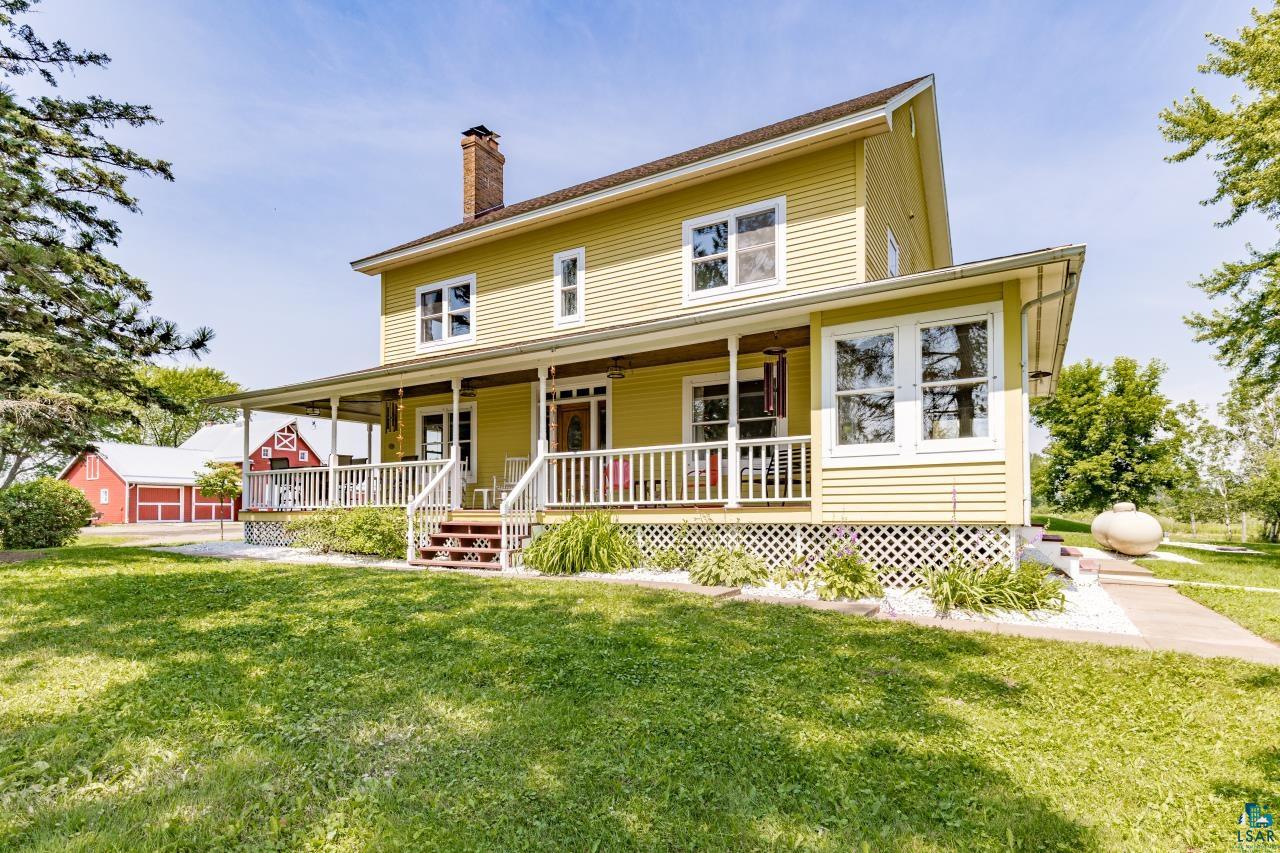 33415 Jackson Road Askov, MN 55704 - Photo 17 of 91 View of front of property featuring covered porch, a front yard, and a chimney