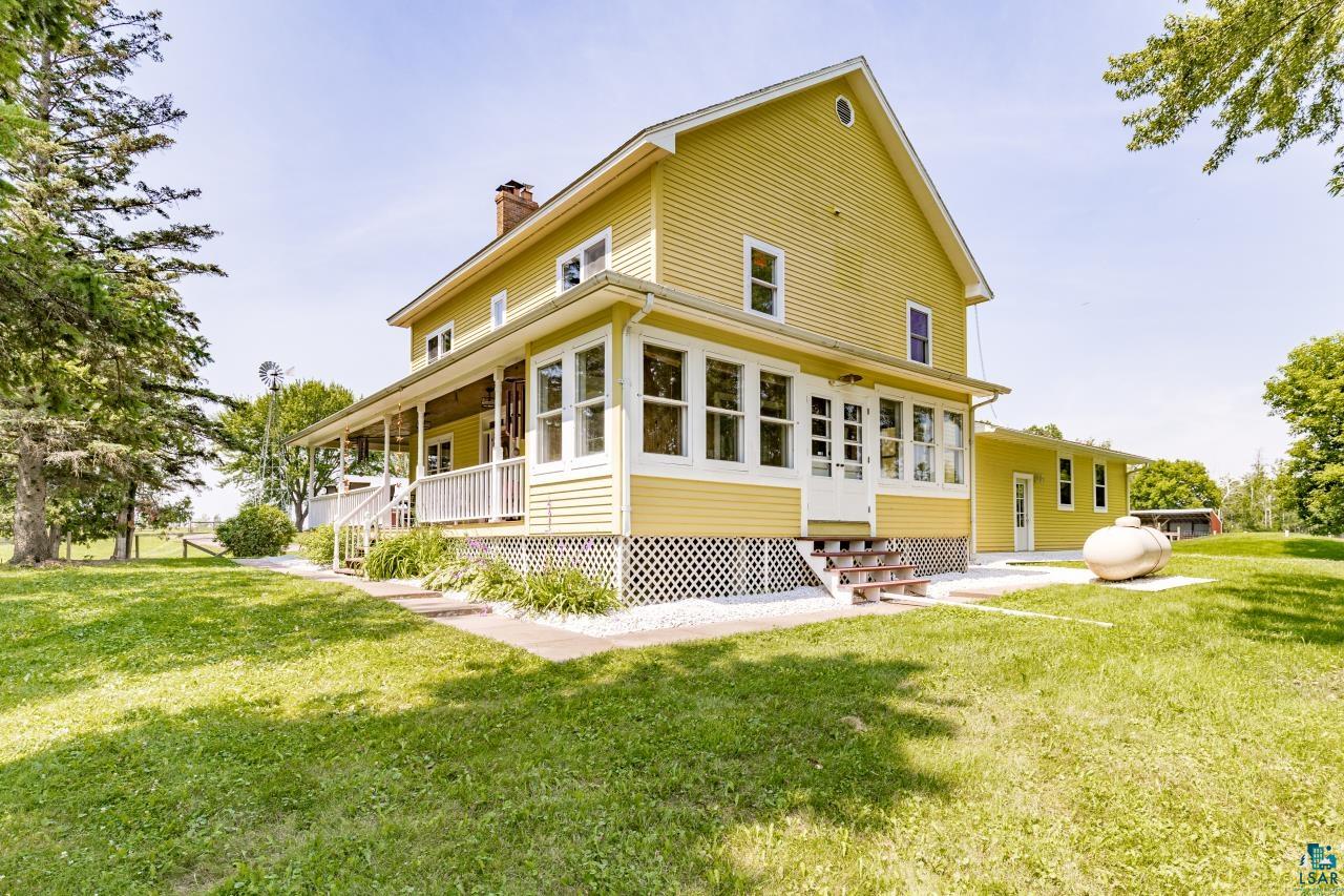 33415 Jackson Road Askov, MN 55704 - Photo 18 of 91 Back of house with a lawn, a chimney, and entry steps