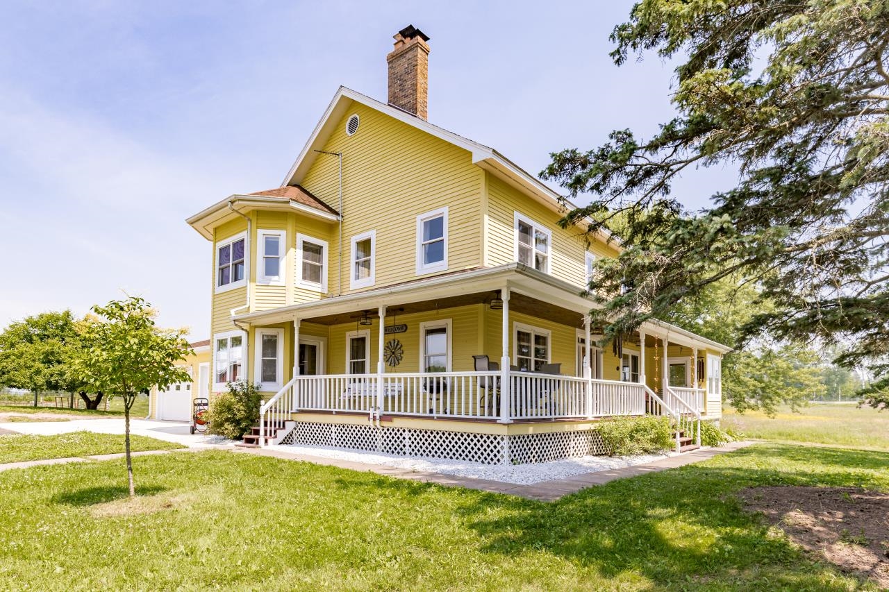 33415 Jackson Road Askov, MN 55704 - Photo 19 of 91 View of front of house with covered porch, a front lawn, driveway, and a garage